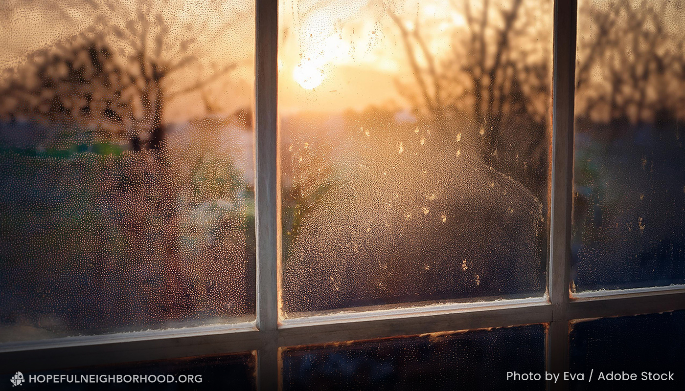 2025-08-blog_hnp_windows1 Sunrise viewed through a hazy, dirty window.