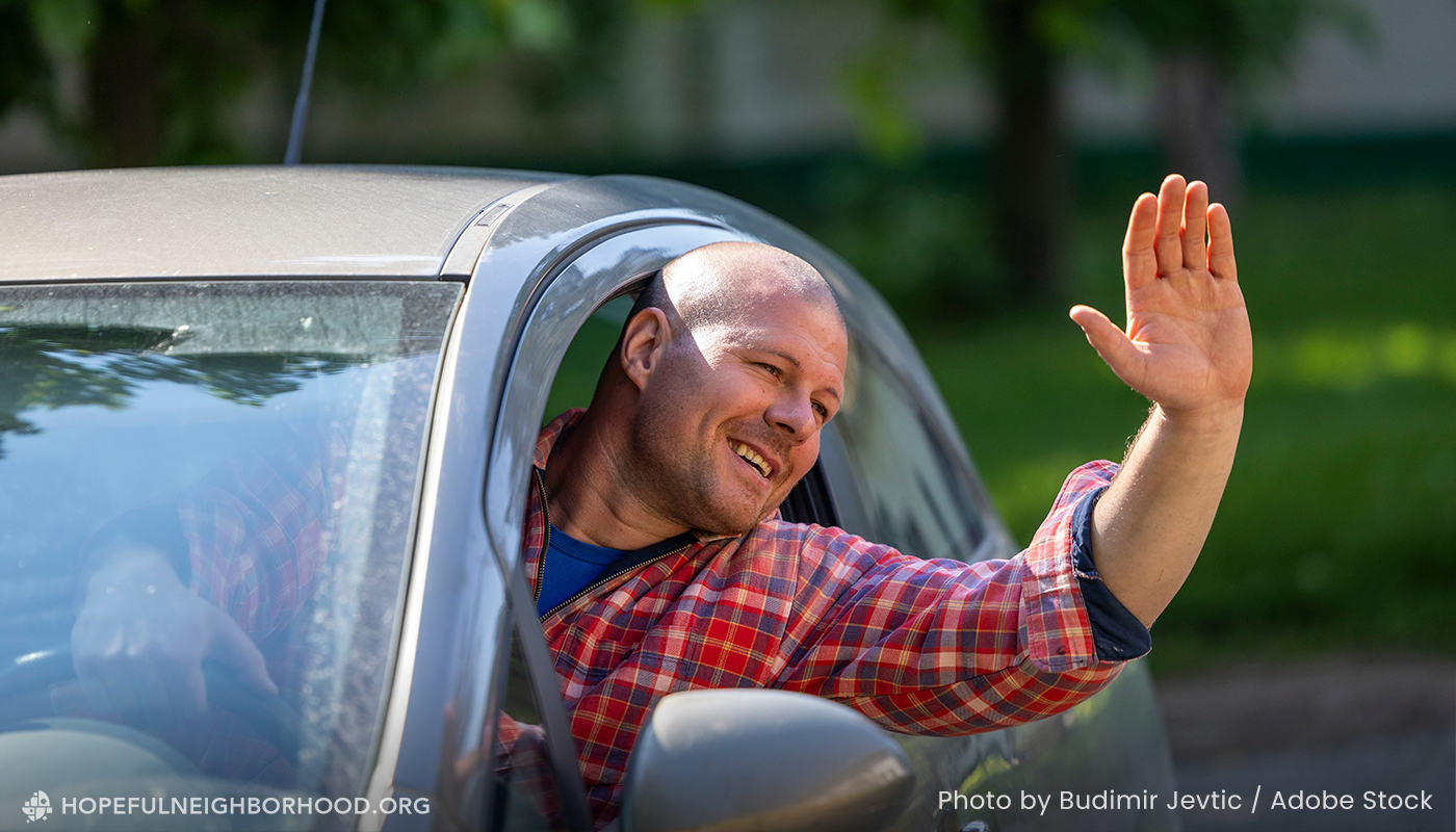 State of Neighboring in Missouri shown by a man waving out of a car window